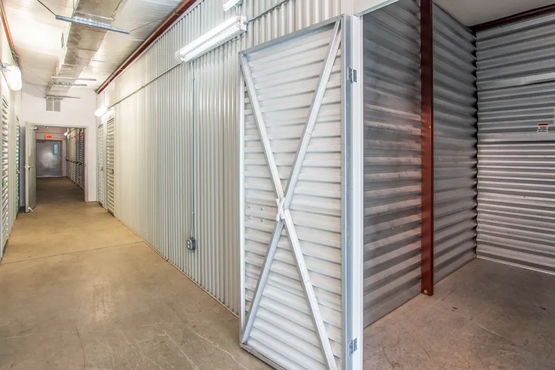 Indoor storage unit with roll-up door inside secure facility